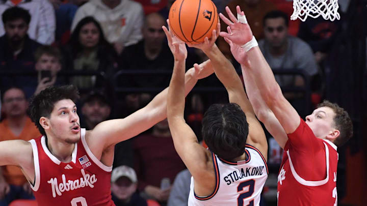 Nebraska forward Berke Buyuktuncel (left) and Cale Jacobsen try to block the shot of Illinois guard Andrej Stojakovic during the second half at State Farm Center. Nebraska forward Berke Buyuktuncel (left) and Cale Jacobsen try to block the shot of Illinois guard Andrej Stojakovic during the second half at State Farm Center.