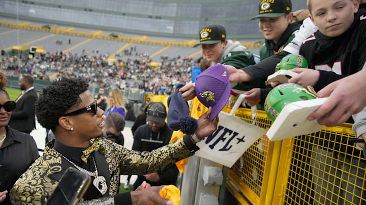 Matthew Golden signs autographs before being drafted in the first round by the Green Bay Packers. Matthew Golden signs autographs before being drafted in the first round by the Green Bay Packers.