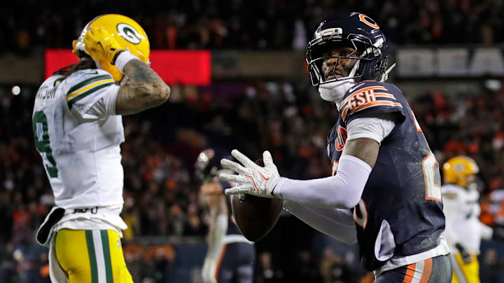 Chicago Bears cornerback Nahshon Wright (26) throws the game ball into the crowd as Green Bay Packers wide receiver Christian Watson (9) reacts to losing the game at the end of their wild-card playoff football game Saturday, January 10, 2026, at Soldier Field in Chicago, Illinois.