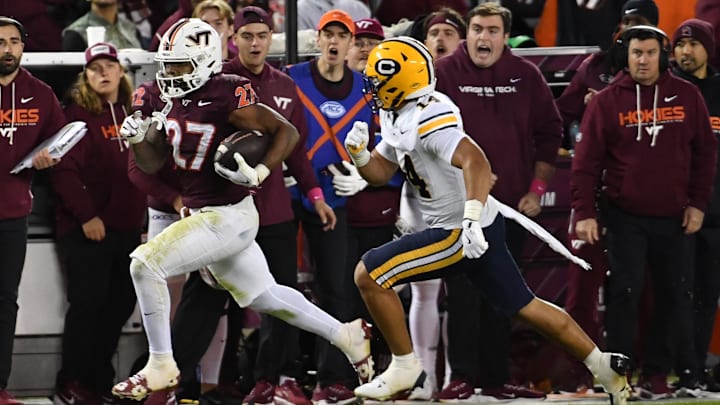 Oct 24, 2025; Blacksburg, Va.; Virginia Tech running back Marcellous Hawkins (27) runs the ball. Oct 24, 2025; Blacksburg, Va.; Virginia Tech running back Marcellous Hawkins (27) runs the ball.