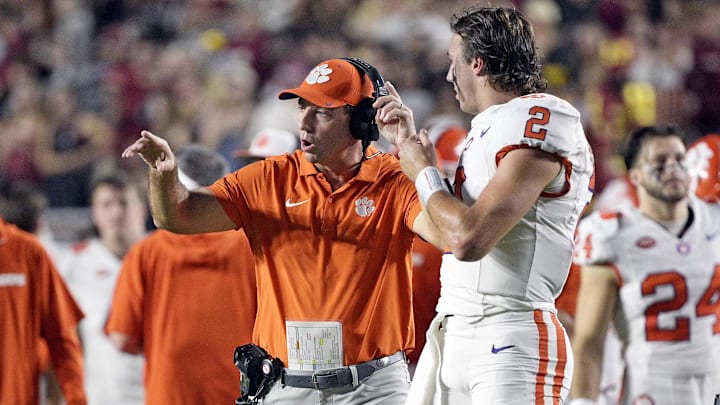 Oct 5, 2024; Tallahassee, Florida, USA; Clemson Tigers head coach Dabo Swinney talks with quarterback Cade Klubnik (2) during the first half against the Florida State Seminoles at Doak S. Campbell Stadium. Oct 5, 2024; Tallahassee, Florida, USA; Clemson Tigers head coach Dabo Swinney talks with quarterback Cade Klubnik (2) during the first half against the Florida State Seminoles at Doak S. Campbell Stadium.