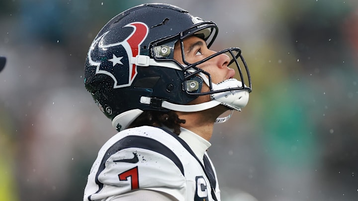 Dec 10, 2023; East Rutherford, New Jersey, USA; Houston Texans quarterback C.J. Stroud (7) walks off the field after an apparent injury during the second half against the New York Jets at MetLife Stadium. Mandatory Credit: Vincent Carchietta-Imagn Images