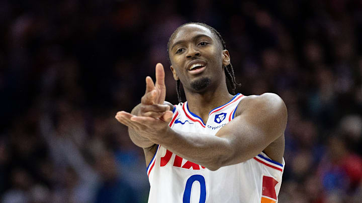 Dec 23, 2024; Philadelphia, Pennsylvania, USA; Philadelphia 76ers guard Tyrese Maxey (0) reacts to his three pointer in the closing moments of the game against the San Antonio Spurs at Wells Fargo Center. Mandatory Credit: Bill Streicher-Imagn Images