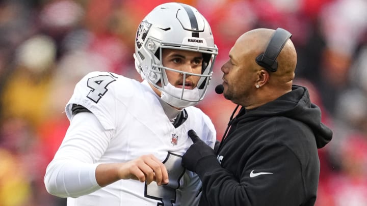 Dec 25, 2023; Kansas City, Missouri, USA; Las Vegas Raiders quarterback Aidan O'Connell (4) talks with head coach Antonio Pierce during the second half against the Las Vegas Raiders at GEHA Field at Arrowhead Stadium. Mandatory Credit: Jay Biggerstaff-USA TODAY Sports