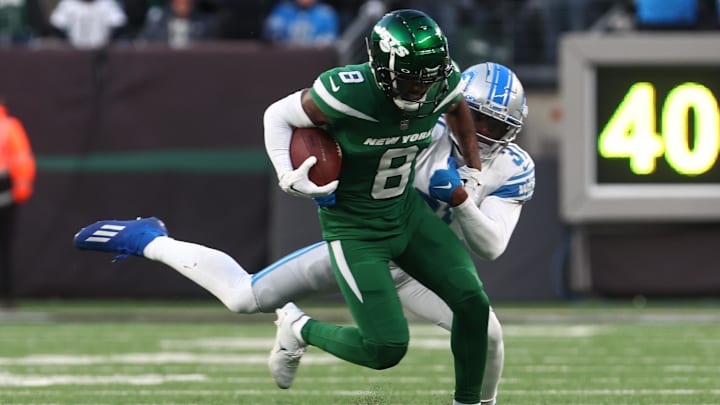 Dec 18, 2022; East Rutherford, New Jersey, USA; New York Jets wide receiver Elijah Moore (8) runs with the ball against the Detroit Lions during the second half at MetLife Stadium.