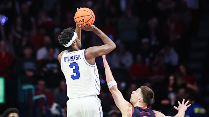 Feb 18, 2026; Tucson, Arizona, USA; Brigham Young Cougars forward AJ Dybantsa (3) makes a three pointer over Arizona Wildcats forward Ivan Kharchenkov (8) during the second half of the game at McKale Memorial Center. Mandatory Credit: Aryanna Frank-Imagn Images