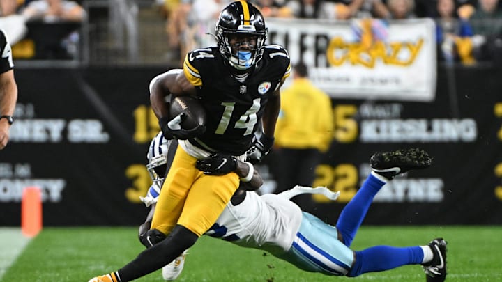Pittsburgh Steelers wide receiver George Pickens breaks a tackle by Dallas Cowboys cornerback Jourdan Lewis. Pittsburgh Steelers wide receiver George Pickens breaks a tackle by Dallas Cowboys cornerback Jourdan Lewis.