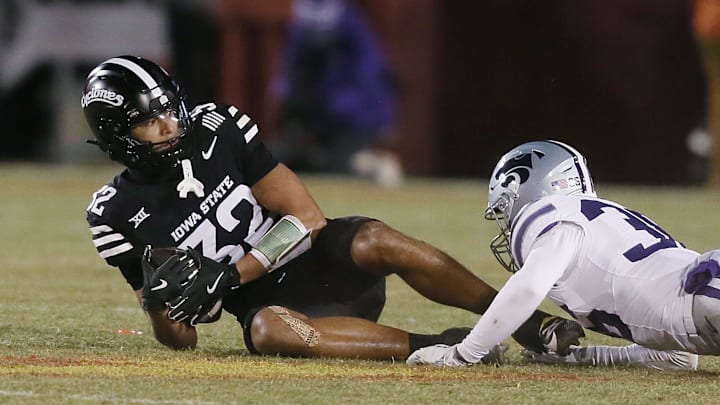 Iowa State Cyclones wide receiver Carson Brown (32) gets tackle by Kansas State Wildcats linebacker Desmond Purnell (32) after making a catch during the third quarter in the NCAA football at Jack Trice Stadium on Saturday, Nov. 30, 2024, in Ames, Iowa.