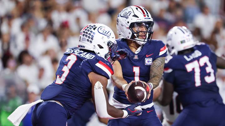 Oct 3, 2026; Tucson, Arizona, USA; Arizona Wildcats quarterback Noah Fifita (1) hands the ball off during the second quarter of the game against the Cincinnati Bearcats at Casino Del Sol Stadium. Oct 3, 2026; Tucson, Arizona, USA; Arizona Wildcats quarterback Noah Fifita (1) hands the ball off during the second quarter of the game against the Cincinnati Bearcats at Casino Del Sol Stadium.