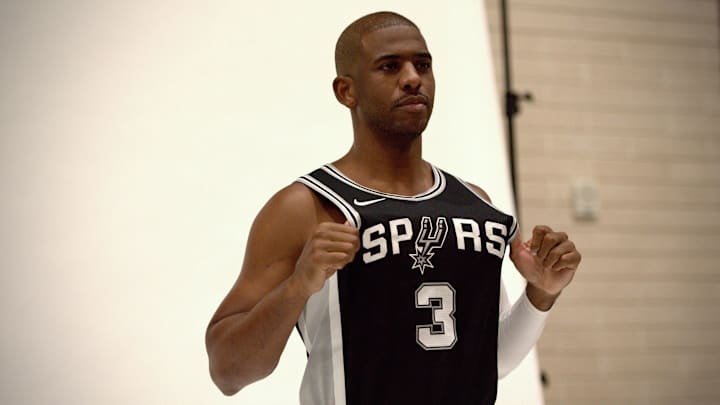 Sep 30, 2024; San Antonio, Texas, USA; San Antonio Spurs point guard Chris Paul (3) poses for a photo shoot during the team's Media Day at Victory Capital Performance Center. Sep 30, 2024; San Antonio, Texas, USA; San Antonio Spurs point guard Chris Paul (3) poses for a photo shoot during the team's Media Day at Victory Capital Performance Center.
