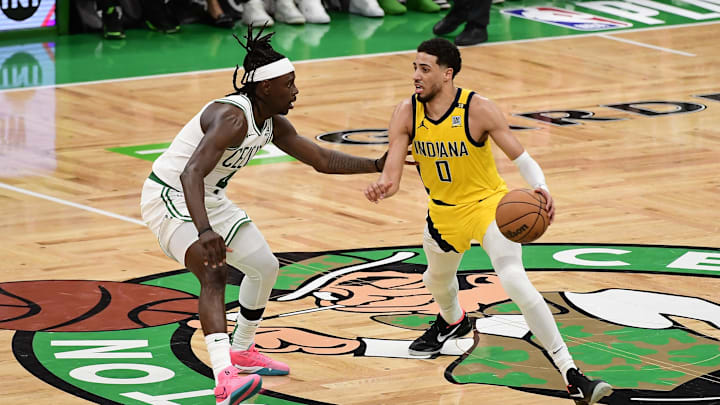 May 21, 2024; Boston, Massachusetts, USA; Indiana Pacers guard Tyrese Haliburton (0) dribbles the ball against Boston Celtics guard Jrue Holiday (4) in overtime for game one of the eastern conference finals for the 2024 NBA playoffs at TD Garden. Mandatory Credit: Bob DeChiara-USA TODAY Sports May 21, 2024; Boston, Massachusetts, USA; Indiana Pacers guard Tyrese Haliburton (0) dribbles the ball against Boston Celtics guard Jrue Holiday (4) in overtime for game one of the eastern conference finals for the 2024 NBA playoffs at TD Garden. Mandatory Credit: Bob DeChiara-USA TODAY Sports