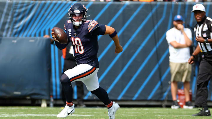 Caleb Williams takes off for a first down on a scramble against the Titans in Sunday's win. Caleb Williams takes off for a first down on a scramble against the Titans in Sunday's win.