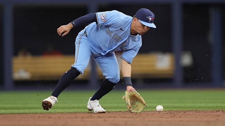 Toronto Blue Jays second baseman Luis Urias (48) fields a ground ball. 