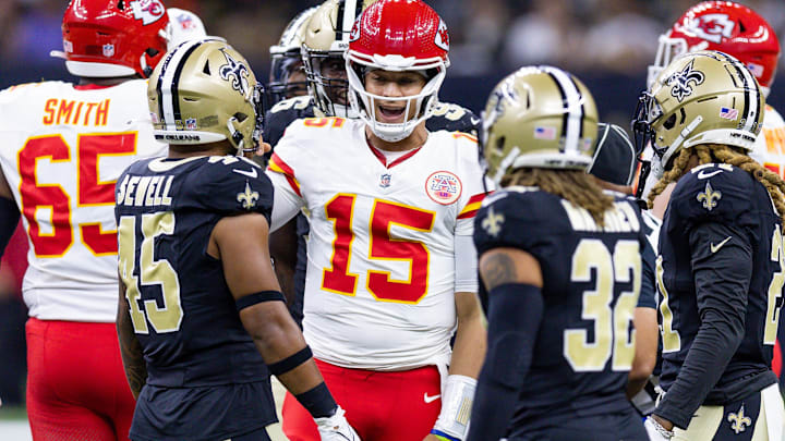 Kansas City Chiefs quarterback Patrick Mahomes (15) talks to New Orleans Saints linebacker Nephi Sewell (45) and safety Tyrann Mathieu (32) Kansas City Chiefs quarterback Patrick Mahomes (15) talks to New Orleans Saints linebacker Nephi Sewell (45) and safety Tyrann Mathieu (32)