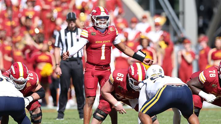 Oct 3, 2026; Ames, Iowa, USA;  Iowa State Cyclones offensive lineman Braden Smith (63) snaps the football to Iowa State Cyclones quarterback Jaylen Raynor (1) during the second half in their game with the West Virginia Mountaineers at Jack Trice Stadium.  Mandatory Credit: Reese Strickland-Imagn Images