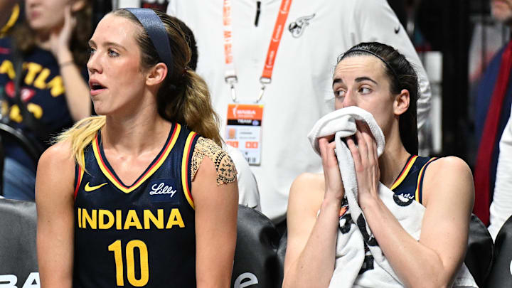 Sep 22, 2024; Uncasville, Connecticut, USA; Indiana Fever guard Lexie Hull (10) and Indiana Fever guard Caitlin Clark (22) watch from the bench in the fourth quarter during game one of the first round of the 2024 WNBA Playoffs at Mohegan Sun Arena. Mandatory Credit: Mark Smith-Imagn Images Sep 22, 2024; Uncasville, Connecticut, USA; Indiana Fever guard Lexie Hull (10) and Indiana Fever guard Caitlin Clark (22) watch from the bench in the fourth quarter during game one of the first round of the 2024 WNBA Playoffs at Mohegan Sun Arena. Mandatory Credit: Mark Smith-Imagn Images