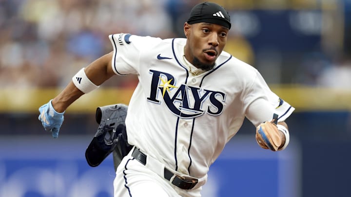 Apr 12, 2026; St. Petersburg, Florida, USA; Tampa Bay Rays left fielder Chandler Simpson (14) runs to third base against the New York Yankees in the first inning at Tropicana Field.