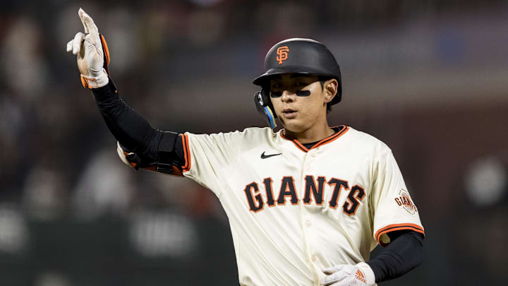 Apr 7, 2025; San Francisco, California, USA;  San Francisco Giants center fielder Jung Hoo Lee (51) gestures after hitting a single against the Cincinnati Reds during the ninth inning at Oracle Park.