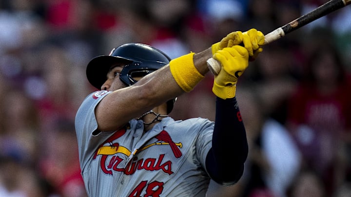 May 28, 2024; Cincinnati, Ohio, USA; St. Louis Cardinals catcher Iván Herrera (48) hits a base hit in the sixth inning at Great American Ball Park. Mandatory Credit: Albert Cesare-Imagn Images