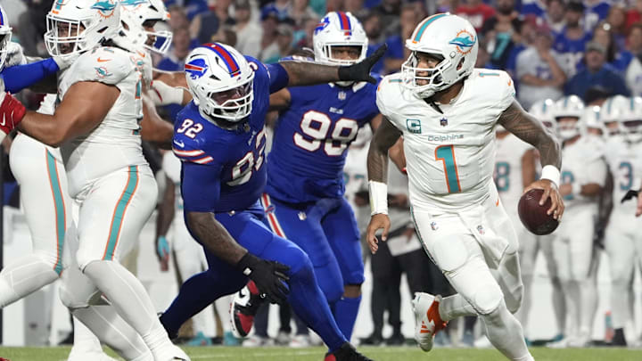 Miami Dolphins quarterback Tua Tagovailoa (1) looks to pass against Buffalo Bills defensive tackle Daquan Jones (92) in the third quarter at Highmark Stadium.