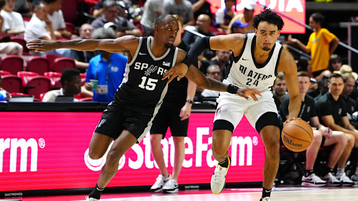 Jul 13, 2024; Las Vegas, NV, USA; Portland Trail Blazers forward Justin Minaya (24) dribbles against San Antonio Spurs guard Jamaree Bouyea (15) during the fourth quarter at Thomas & Mack Center. Jul 13, 2024; Las Vegas, NV, USA; Portland Trail Blazers forward Justin Minaya (24) dribbles against San Antonio Spurs guard Jamaree Bouyea (15) during the fourth quarter at Thomas & Mack Center.