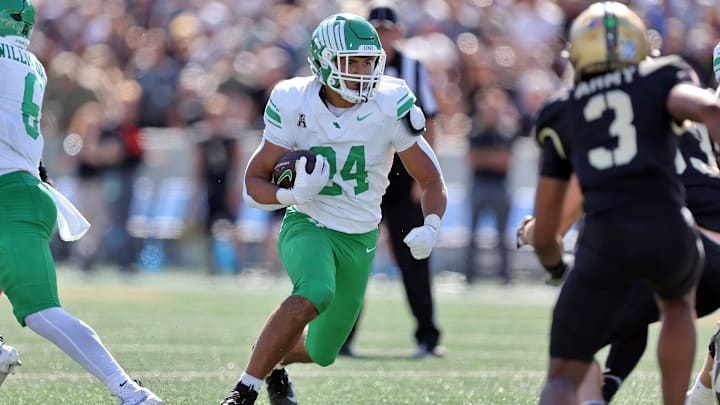 Sep 20, 2025; West Point, New York, USA; North Texas Mean Green running back Caleb Hawkins (24) runs for a touchdown against the Army Black Knights during the second half at Michie Stadium. Mandatory Credit: Danny Wild-Imagn Images