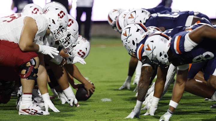 Sep 20, 2025; Charlottesville, Virginia, USA; The Stanford Cardinal offense lines up for an extra point conversion against the Virginia Cavaliers defense during the first quarter at Scott Stadium. Mandatory Credit: Geoff Burke-Imagn Images