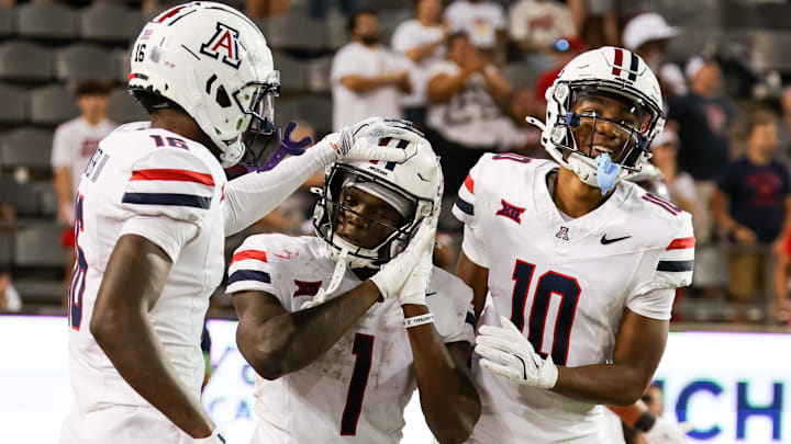 Aug 31, 2024; Tucson, Arizona, USA; Arizona Wildcats running back Jacory Croskey-Merritt (1) celebrates touchdown with Arizona Wildcats wide receiver Chris Hunter (16) and Arizona Wildcats wide receiver Malachi Riley (10) during fourth quarter at Arizona Stadium. Mandatory Credit: Aryanna Frank-Imagn Images