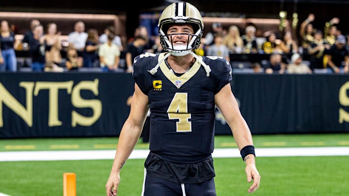 Nov 17, 2024; New Orleans, Louisiana, USA;  New Orleans Saints quarterback Derek Carr (4) reacts after tight end Taysom Hill (not pictured) scores a touchdown against the Cleveland Browns during the second half at Caesars Superdome. Mandatory Credit: Stephen Lew-Imagn Images