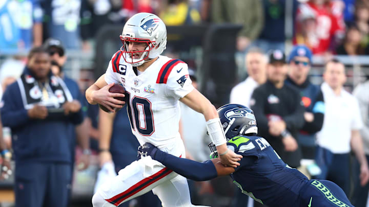 Feb 8, 2026; Santa Clara, CA, USA; New England Patriots quarterback Drake Maye (10) runs against Seattle Seahawks safety Nick Emmanwori (3) during the first quarter in Super Bowl LX at Levi's Stadium. Mandatory Credit: Mark J. Rebilas-Imagn Images
