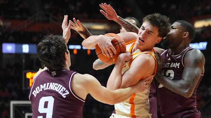 Tennessee forward J.P. Estrella (13) struggles to keep the ball between Texas A&M guard Ruben Dominguez (9) and Texas A&M forward Rashaun Agee (12) during a NCAA basketball game between Tennessee and Texas A&M at Thompson-Boling Arena at Food City Center in Knoxville, Tenn., on Jan. 13, 2026.