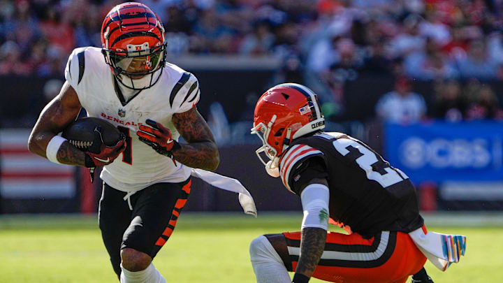 Cincinnati Bengals wide receiver Ja'Marr Chase (1) runs the ball past Cleveland Browns cornerback Denzel Ward (21) in the NFL Week 7 game at Huntington Bank Field in Cleveland October 20, 2024. The Bengals won 21-14.