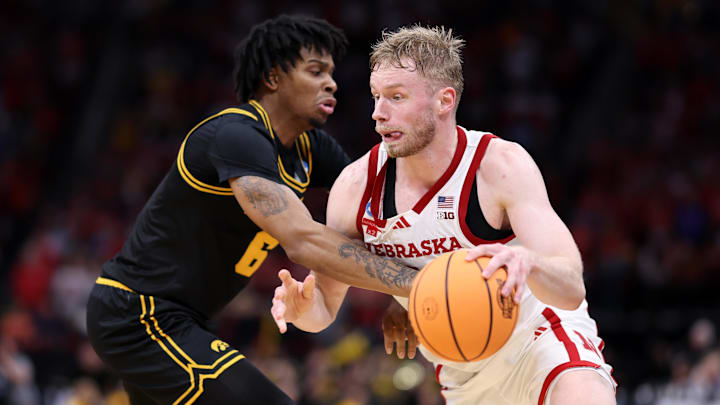 Nebraska Cornhuskers forward Rienk Mast dribbles the ball past Iowa Hawkeyes guard Tavion Banks in the second half during a Sweet Sixteen game of the South Regional of the men's 2026 NCAA Tournament at Toyota Center.