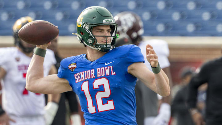 Jan 29, 2026; Mobile, AL, USA; National quarterback Sawyer Robertson (12) of Baylor throws the ball during National Senior Bowl practice at Hancock Whitney Stadium.  