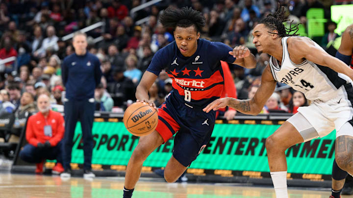 Feb 10, 2025; Washington, District of Columbia, USA; Washington Wizards guard Bub Carrington (8) drives to the basket against San Antonio Spurs guard Devin Vassell (24) during the first quarter at Capital One Arena. Mandatory Credit: Reggie Hildred-Imagn Images Feb 10, 2025; Washington, District of Columbia, USA; Washington Wizards guard Bub Carrington (8) drives to the basket against San Antonio Spurs guard Devin Vassell (24) during the first quarter at Capital One Arena. Mandatory Credit: Reggie Hildred-Imagn Images