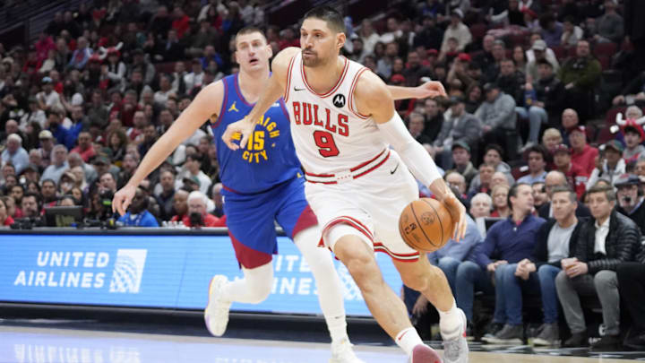 Denver Nuggets center Nikola Jokic (15) defends Chicago Bulls center Nikola Vucevic (9) during the first half at United Center. Mandatory Credit: David Banks-Imagn Images