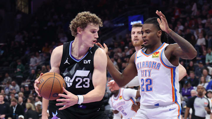 Nov 21, 2025; Salt Lake City, Utah, USA; Utah Jazz forward Lauri Markkanen (23) posts up against Oklahoma City Thunder guard Cason Wallace (22) during the second half at Delta Center. Mandatory Credit: Rob Gray-Imagn Images