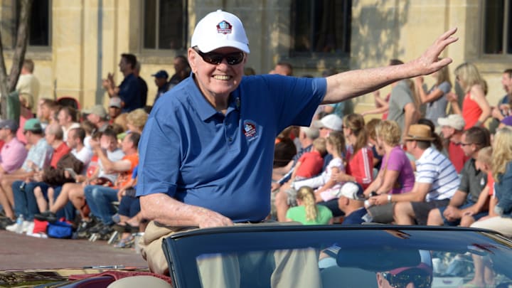 Aug 2, 2014; Canton, OH, USA; Sonny Jurgensen waves to the crowd at the TimkenSteel Grand Parade on Cleveland Avenue in advance of the 2014 Pro Football Hall of Fame Enshrinement.