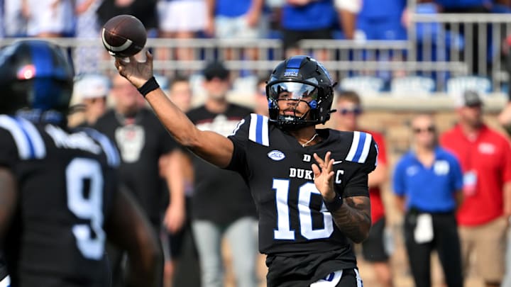 Sep 20, 2025; Durham, North Carolina, USA;  Duke football quarter back Darian Mensah (10) throws the ball during the first quarter against the NC State Wolfpack at Wallace Wade Stadium. Mandatory Credit: Zachary Taft-Imagn Images