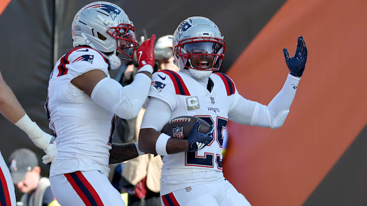 Nov 23, 2025; Cincinnati, Ohio, USA; New England Patriots cornerback Marcus Jones (25) celebrates with teammates after scoring a touchdown during the first half against the Cincinnati Bengals at Paycor Stadium.