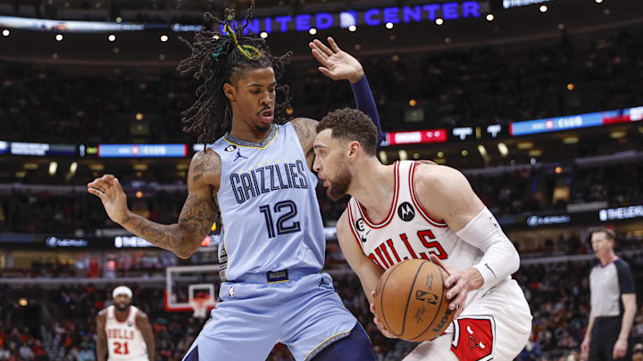 Memphis Grizzlies guard Ja Morant (12) defends against Chicago Bulls guard Zach LaVine (8) during the second half at United Center. Mandatory Credit: Kamil Krzaczynski-Imagn Images
