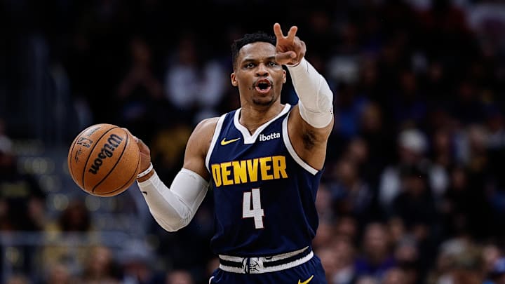 Apr 2, 2025; Denver, Colorado, USA; Denver Nuggets guard Russell Westbrook (4) gestures as he dribbles the ball up court in the third quarter against the San Antonio Spurs at Ball Arena. Mandatory Credit: Isaiah J. Downing-Imagn Images