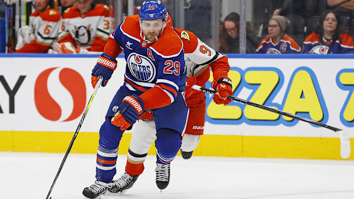 Jan 3, 2025; Edmonton, Alberta, CAN; Edmonton Oilers forward Leon Draisaitl (29) looks to make a play in front of forward Leo Carlsson (91) during the third period at Rogers Place. Mandatory Credit: Perry Nelson-Imagn Images