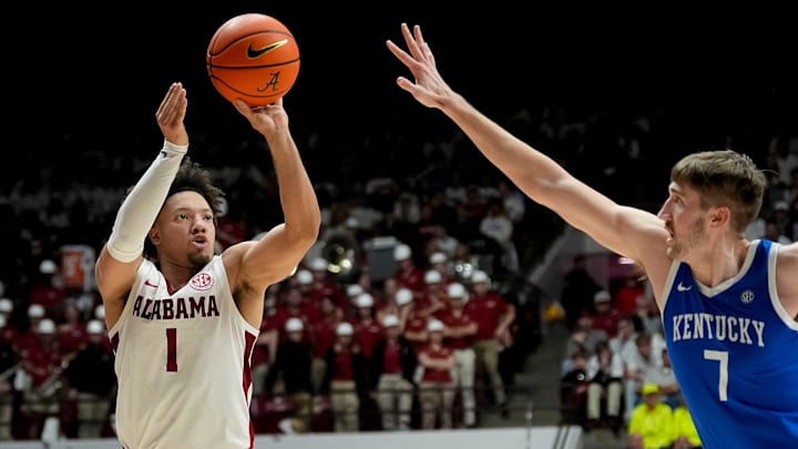 Feb 22, 2025; Tuscaloosa, AL, USA; Alabama guard Mark Sears (1) shoots a three over Kentucky forward Andrew Carr (7) at Coleman Coliseum. Alabama defeated Kentucky 96-83. Sears scored 30 points for Alabama. Mandatory Credit: Gary Cosby Jr.-Tuscaloosa News