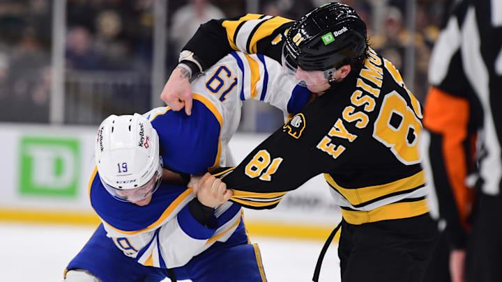 Oct 30, 2025; Boston, Massachusetts, USA; Boston Bruins center Michael Eyssimont (81) fights with Buffalo Sabres center Peyton Krebs (19) during the third period at TD Garden. Mandatory Credit: Bob DeChiara-Imagn Images