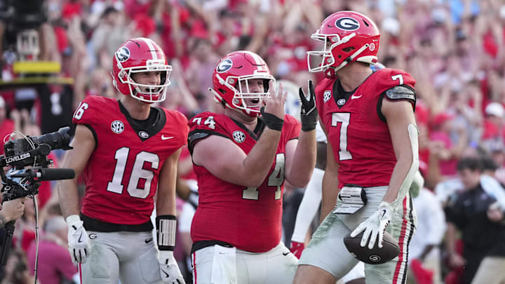 Oct 18, 2025; Athens, Georgia, USA; Georgia Bulldogs tight end Lawson Luckie (7) celebrates his touchdown with offensive lineman Drew Bobo (74) and wide receiver London Humphreys (16)  during the fourth quarter of the game against the Mississippi Rebels at Sanford Stadium. Mandatory Credit: Dale Zanine-Imagn Images