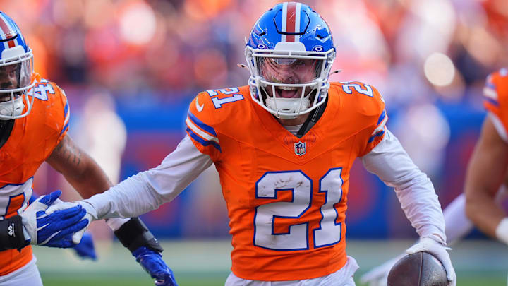 Oct 6, 2024; Denver, Colorado, USA; Denver Broncos cornerback Riley Moss (21) celebrates his interception in the second half against the Las Vegas Raiders at Empower Field at Mile High. Mandatory Credit: Ron Chenoy-Imagn Images Oct 6, 2024; Denver, Colorado, USA; Denver Broncos cornerback Riley Moss (21) celebrates his interception in the second half against the Las Vegas Raiders at Empower Field at Mile High. Mandatory Credit: Ron Chenoy-Imagn Images
