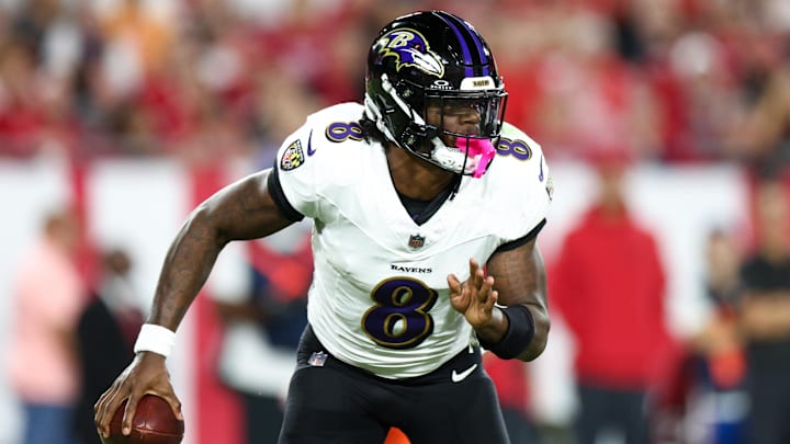 Oct 21, 2024; Tampa, Florida, USA; Baltimore Ravens quarterback Lamar Jackson (8) drops back to pass against the Tampa Bay Buccaneers in the second quarter at Raymond James Stadium. Mandatory Credit: Nathan Ray Seebeck-Imagn Images