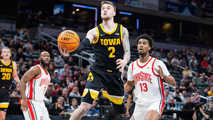 Mar 12, 2025; Indianapolis, IN, USA; Iowa Hawkeyes guard Brock Harding (2) shoots the ball while Ohio State Buckeyes forward Sean Stewart (13) defends in the first half at Gainbridge Fieldhouse. Mandatory Credit: Trevor Ruszkowski-Imagn Images Mar 12, 2025; Indianapolis, IN, USA; Iowa Hawkeyes guard Brock Harding (2) shoots the ball while Ohio State Buckeyes forward Sean Stewart (13) defends in the first half at Gainbridge Fieldhouse. Mandatory Credit: Trevor Ruszkowski-Imagn Images
