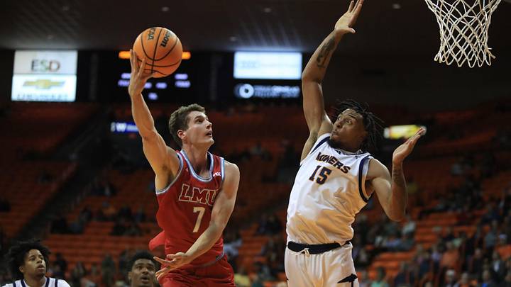 LMU Lions guard Jan Vide (7) scores despite a leaping block attempt by UTEP Miners forward Jamal West Jr. (15) during a game at the Don Haskins Center, Nov. 11, 2025, in El Paso, Texas. LMU Lions guard Jan Vide (7) scores despite a leaping block attempt by UTEP Miners forward Jamal West Jr. (15) during a game at the Don Haskins Center, Nov. 11, 2025, in El Paso, Texas.